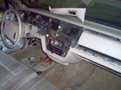 1994 Ford Crown Victoria - The interior dashboard of a 1994 Ford Crown Victoria is shown with various components disassembled.