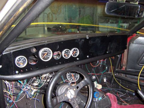1971 Ford Mustang - Custom dashboard installation with numerous gauges and extensive wiring visible.