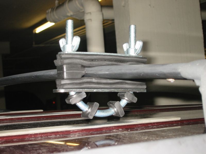 Compressing the bushings prior to fitting the jack.