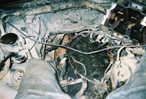 1988 Ford Bronco - This is a view of the engine bay, showing various components and wiring. The condition appears to be dirty and in need of maintenance.