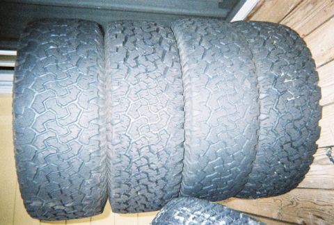 1988 Ford Bronco - A set of four tires is displayed, with a watermark indicating 'SUPERMOTORS.NET' at the bottom right.