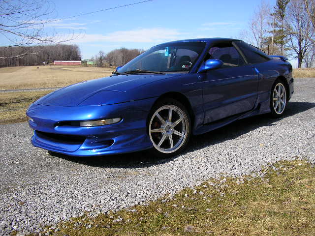 Blue 1994 Ford Probe coupe, 3/4 front view