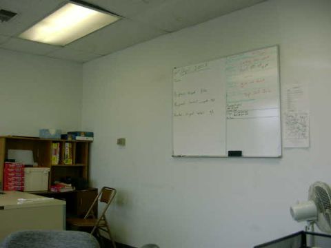 1999 Jeep Grand Cherokee - Whiteboard in an office lists tasks, with shelves and a desk visible in the background.
