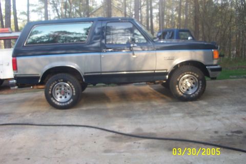 1979 Ford F-150 - This Ford Bronco has a two-tone paint scheme with a blue stripe. The date stamp on the photo reads 03/30/2005.