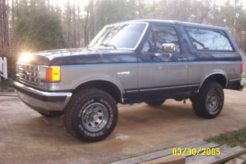 1979 Ford F-150 - This two-tone Ford Bronco is visible from the front-left angle.