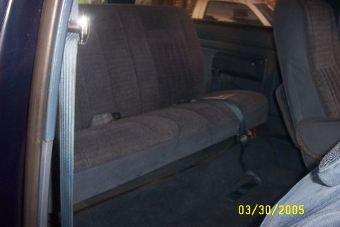 1979 Ford F-150 - Interior view of a vehicle's rear bench seat with seatbelts, dated 03/30/2005.