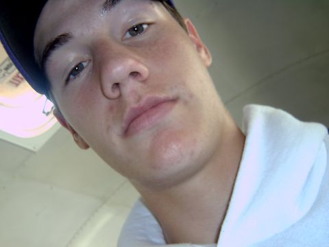 1998 Jeep TJ - A young man takes a selfie, showing his face and upper body. The Supermotors logo is visible in the corner.