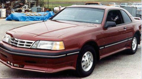1973 Ford Ranchero - This maroon coupe has a distinctive chrome grille and silver wheels.