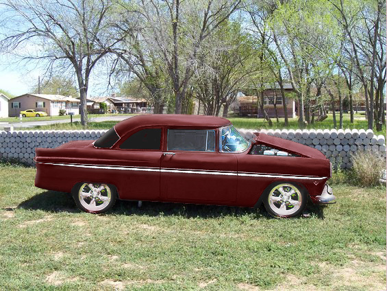 Maroon 1955 Ford Customline sedan, side view, hood open