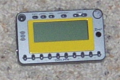 2002 Ford Mustang - A digital gauge with multiple buttons and a green LCD screen is shown.