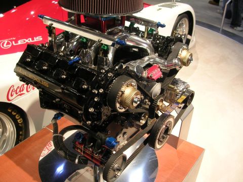 2000 Pontiac Trans Am - Close-up of a high-performance Lexus V8 engine, likely from a race car, on display.