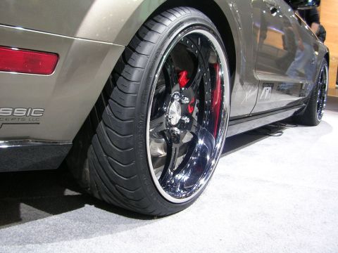 2000 Pontiac Trans Am - Custom wheel and tire assembly on a modified vehicle, showing off aftermarket brakes.
