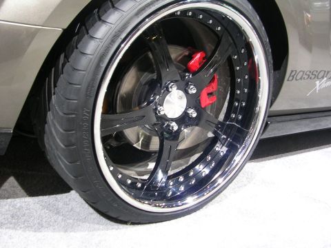2000 Pontiac Trans Am - This image shows a custom wheel with a low-profile tire and red brake calipers, suggesting aftermarket modifications.