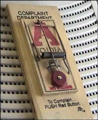 1991 Ford Bronco - A mouse trap is set up in the complaint department, with instructions to push the red button.