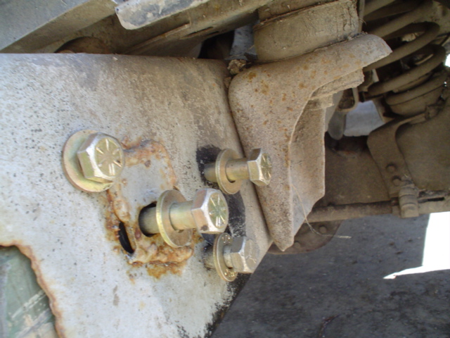 drilled one hole, then put the bolt in and tightened it up, aligned the peice with the frame, then took a 2lb hammer and tapped on the other 3 bolts to leave an imprint so I could drill the other holes in the right spot