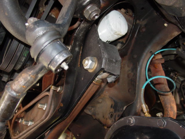 Close-up of steering linkage and oil filter