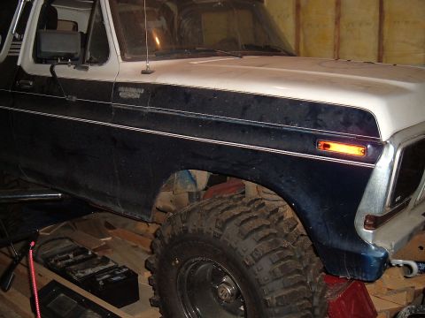 1979 Ford Bronco - This Ford Bronco features a two-tone paint scheme and aggressive off-road tires, suggesting a 1978 model year.