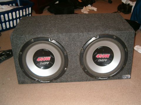 1996 Ford Bronco - A pair of Pioneer subwoofers are shown in a gray carpeted enclosure.