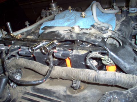 1994 Ford Crown Victoria - The crash bracket barely interferes with the older fuel rail, so I'll grind a small pocket in the bracket for clearance.