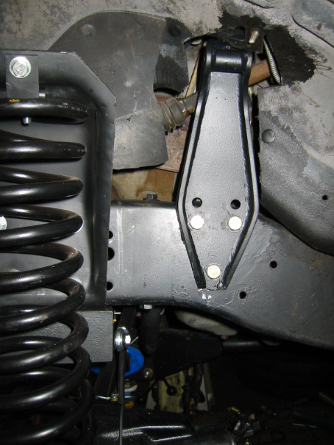1992 Ford Bronco - Aftermarket suspension parts are visible in this close-up view of a vehicle's undercarriage.