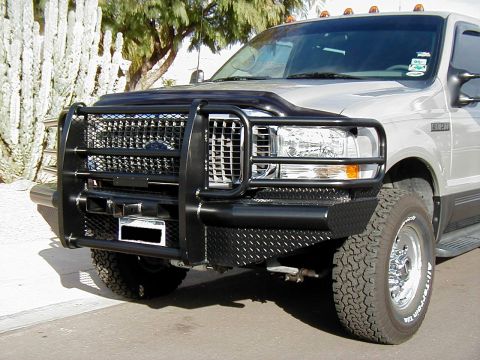 2002 Ford Excursion - This 2002 Ford Excursion features a heavy-duty black brush guard and a custom diamond plate bumper.