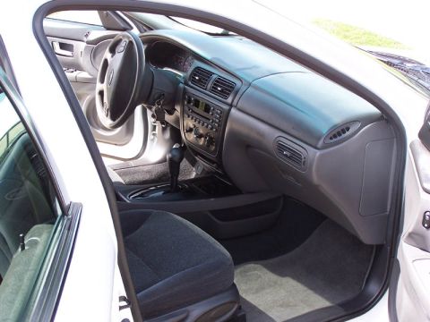 2001 Ford Taurus - Interior view of a 2001 Ford Taurus, showing the dashboard, steering wheel, center console, and front seats.