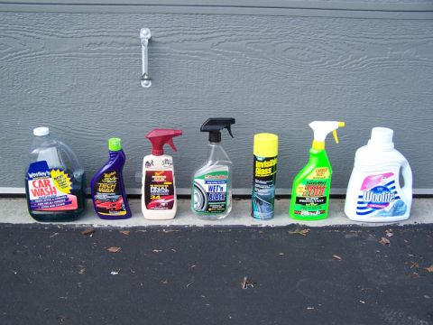 2001 Ford Taurus - A collection of car wash soap, wax, tire cleaner, glass cleaner, and fabric cleaner are displayed on the ground.
