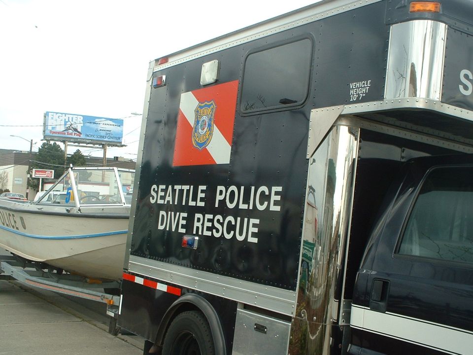 Seattle Police Dive Rescue truck towing a boat on a trailer