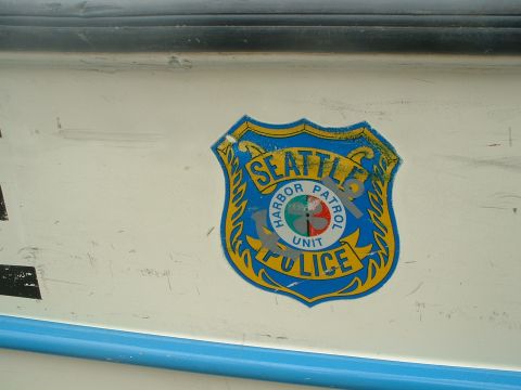 1999 Ford Crown Victoria - Close-up of a Seattle Harbor Patrol Police badge affixed to the side of a vehicle.