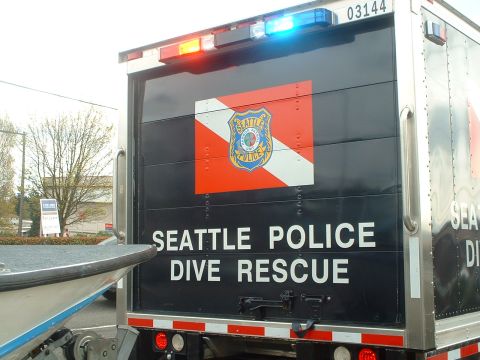 1999 Ford Crown Victoria - Seattle Police Dive Rescue truck with emergency lights illuminated and the Seattle Police logo displayed.