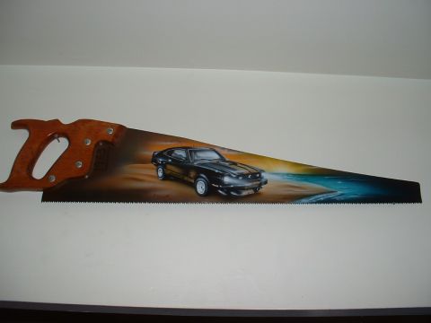 1978 Ford Mustang II - Airbrushed artwork of a classic coupe on a beach scene adorns a hand saw.