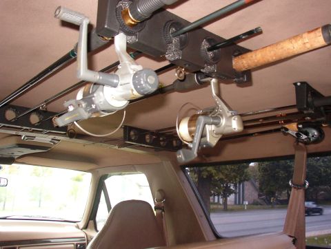 1993 Ford Bronco - Interior view of a vehicle equipped with a ceiling-mounted fishing rod rack.