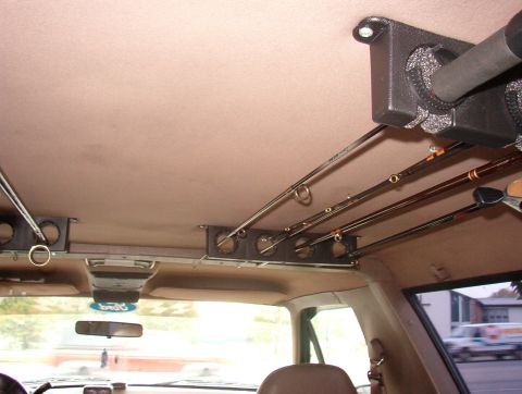1993 Ford Bronco - Fishing rods are neatly stored in a custom rack mounted to the ceiling of this 1993 Ford Bronco.