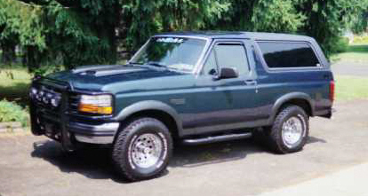 1993 Ford Bronco - This 1993 Ford Bronco is shown from a three-quarter front angle, aftermarket wheels and a brush guard.