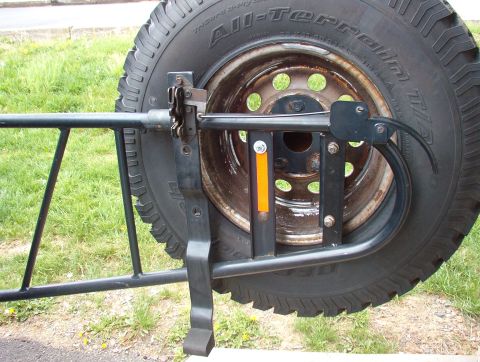 1993 Ford Bronco - This is a close-up of a spare tire carrier, not the entire vehicle.