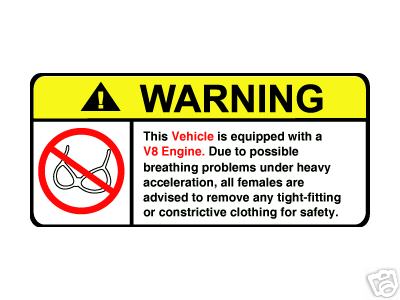 1993 Ford Bronco - Warning label with safety instructions and a prohibition symbol.