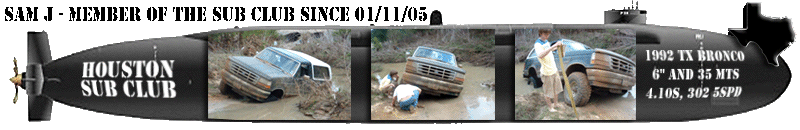 1992 Ford Bronco stuck in mud, front 3/4 view, mud-covered
