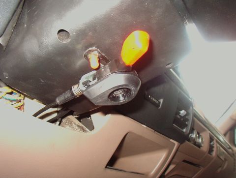 1993 Ford Bronco - A hand throttle control is installed on the dashboard, with visible wiring and a yellow indicator light.