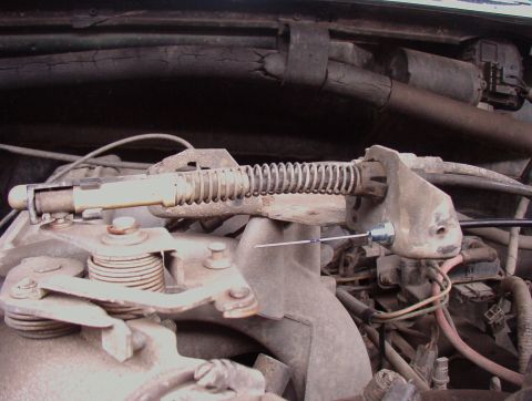 1993 Ford Bronco - This photo shows a close-up view of the throttle linkage and associated engine components.