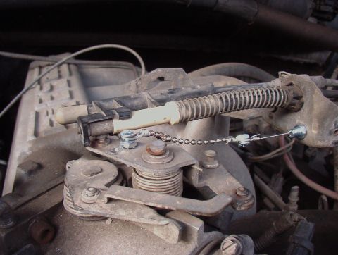 1993 Ford Bronco - Close-up view of a vehicle's throttle body assembly with custom linkage.