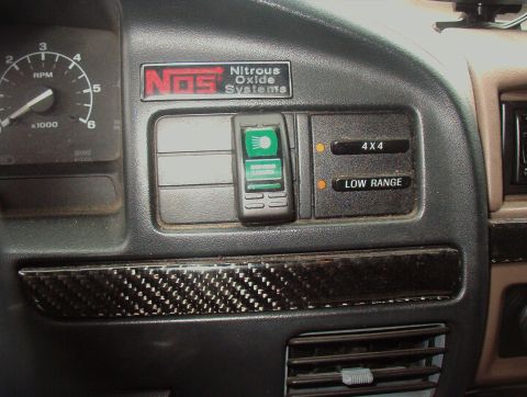 1993 Ford Bronco - The dashboard features a NOS nitrous oxide system control panel and 4x4/low range selectors.