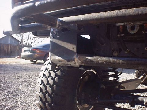 1988 Ford Bronco - Custom bumper and suspension components are the focus, with a second vehicle in the background.