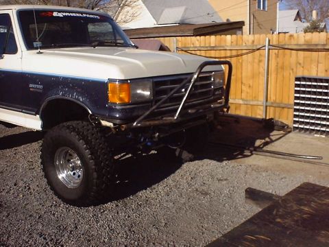 1988 Ford Bronco - This Ford Bronco features a custom front bumper and off-road tires.