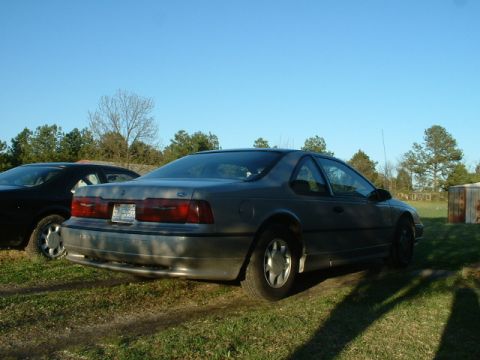 1989 Ford Thunderbird - Rear view of a 1989 Ford Thunderbird. Another car is visible to the left.
