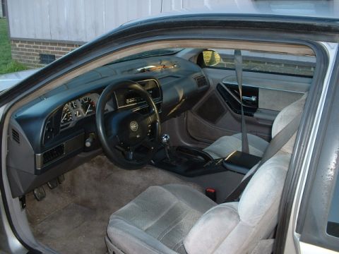 1989 Ford Thunderbird - Interior view of a 1989 Ford Thunderbird, showing the dashboard, seats, and steering wheel.