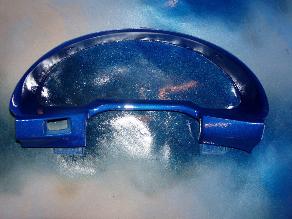 Blue metallic dashboard trim with a cutout for instruments