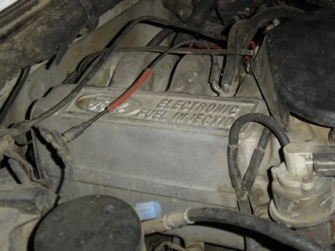 1988 Ford Bronco - Ford engine component with "ELECTRONIC FUEL INJECTION" text visible.