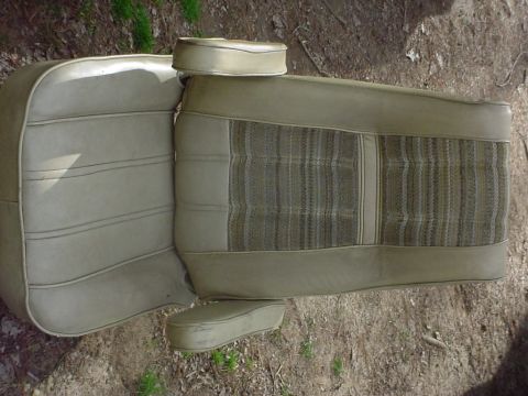 1979 Ford Bronco - A tan car seat with a striped fabric insert and headrests is shown from a top-down perspective.