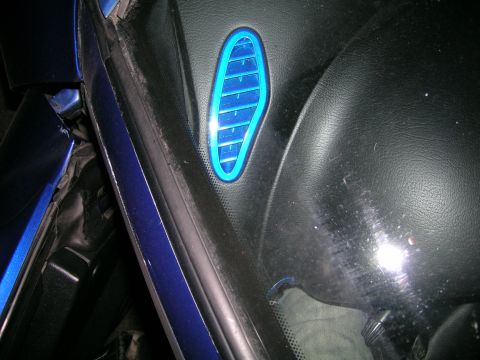 1994 Ford Probe - Close-up of a blue illuminated vent on a car's interior dashboard.