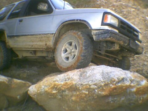 1991 Mazda Navajo - This 1991 Mazda Navajo is navigating a rocky trail, demonstrating its off-road capabilities.